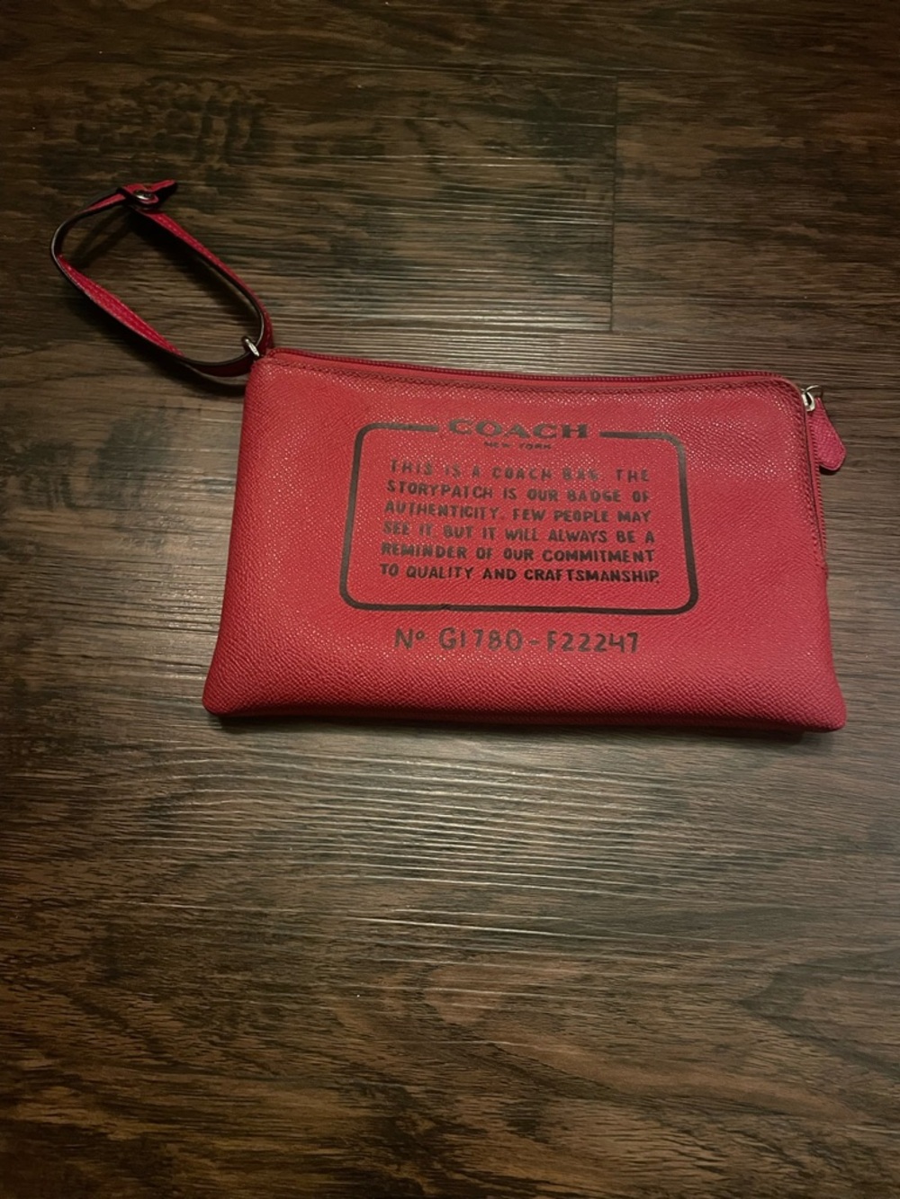 THE COACH STORY NEW YORK RED ZIPPERED CLUTCH BAG 9" X 6"
